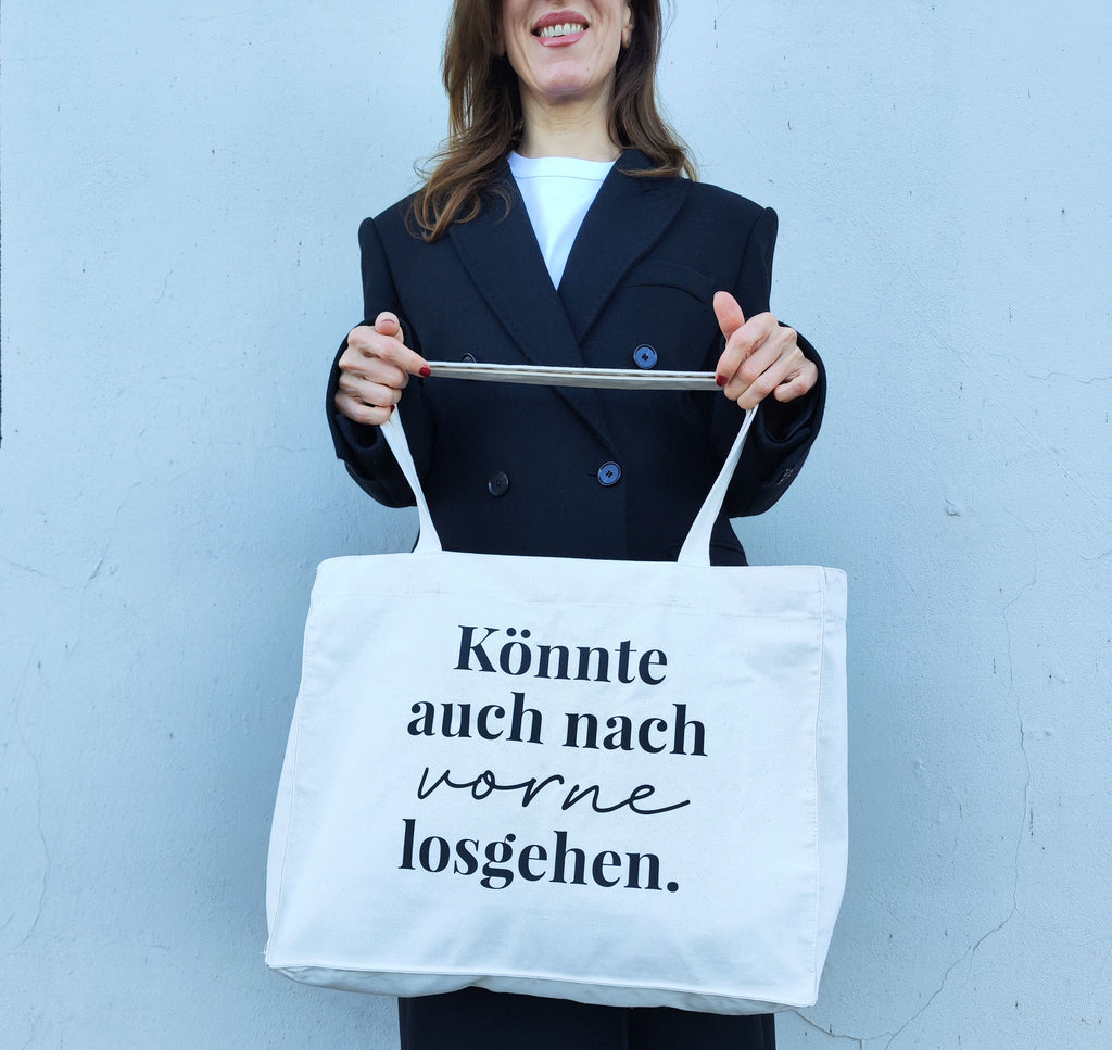 Nachhaltige Einkaufstasche "Könnte auch nach vorne losgehen" aus Bio-Baumwolle mit positivem Statement